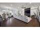 Spacious living room featuring large windows, a cozy fireplace, and elegant decor at 3208 Sonnet Se Walk, Atlanta, GA 30339