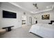 Bright main bedroom features fresh paint, carpet flooring and a large television at 3208 Sonnet Se Walk, Atlanta, GA 30339