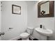 Charming powder room features rustic mirror, modern sink, and updated fixtures at 3208 Sonnet Se Walk, Atlanta, GA 30339