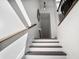 Modern staircase with white risers, dark treads, and iron railing at 3208 Sonnet Se Walk, Atlanta, GA 30339