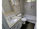 Modern bathroom with granite countertop, tiled walls, hexagon floor tile, and shower-tub combo at 3954 Rhyne Se Way, Smyrna, GA 30082