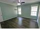 Empty Bedroom featuring light green walls, hardwood floors, ceiling fan and natural light at 3954 Rhyne Se Way, Smyrna, GA 30082