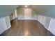 Bedroom with sloped ceilings, hardwood floors, storage doors and neutral walls at 3954 Rhyne Se Way, Smyrna, GA 30082