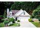 Charming single-Gathering home features a two-car garage, manicured lawn, and traditional architecture at 3954 Rhyne Se Way, Smyrna, GA 30082