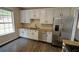 Bright kitchen features white cabinets, granite countertops, and stainless steel appliances at 3954 Rhyne Se Way, Smyrna, GA 30082