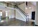 Spacious living room with hardwood floors, tall ceilings, staircase and large windows at 3954 Rhyne Se Way, Smyrna, GA 30082