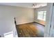 Second-floor loft area with hardwood floors and a large window for natural light at 3954 Rhyne Se Way, Smyrna, GA 30082