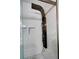 Spa-like shower with multiple showerheads and bench seating. White tile walls and stylish fixtures at 3954 Rhyne Se Way, Smyrna, GA 30082