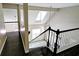 View of a staircase showing hardwood floors and railing leading to the second level loft area at 3954 Rhyne Se Way, Smyrna, GA 30082