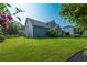 Spacious backyard with lush lawn and landscaping, offering a serene outdoor space at 5223 Willow Ridge Dr, Woodstock, GA 30188