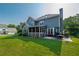 Landscaped backyard with deck and screened porch; ideal for outdoor living at 5223 Willow Ridge Dr, Woodstock, GA 30188