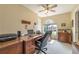 Bedroom featuring a ceiling fan, window, and a desk with an office chair at 5223 Willow Ridge Dr, Woodstock, GA 30188