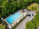 Aerial view showcasing a community pool, lounge areas, and ample parking at 5223 Willow Ridge Dr, Woodstock, GA 30188