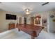 Spacious game room with a covered pool table, tv, and adjacent doorways at 5223 Willow Ridge Dr, Woodstock, GA 30188