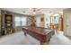 Game room featuring a covered pool table, dartboard, and exterior view through the window at 5223 Willow Ridge Dr, Woodstock, GA 30188