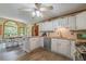 Bright eat-in kitchen with white cabinets, granite countertops, and stainless steel appliances at 5223 Willow Ridge Dr, Woodstock, GA 30188