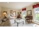 Bright living room with hardwood floors, neutral walls, and bright windows offering natural light at 5223 Willow Ridge Dr, Woodstock, GA 30188