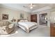 Inviting main bedroom with tray ceiling and adjoined bath at 5223 Willow Ridge Dr, Woodstock, GA 30188