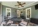 Relax on this slate-floored screened porch with fan and backyard views at 5223 Willow Ridge Dr, Woodstock, GA 30188