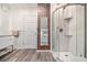 Bathroom with a unique brick accent wall, stand-up shower, and a modern vanity at 879 Wildwood Ne Rd, Atlanta, GA 30324