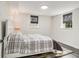 Cozy bedroom featuring light walls, updated windows, and wood look floors at 879 Wildwood Ne Rd, Atlanta, GA 30324