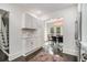 Kitchen features include white cabinets, stainless fridge and adjoining dining area at 879 Wildwood Ne Rd, Atlanta, GA 30324