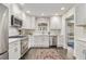 Bright kitchen features stainless steel appliances, white cabinetry, and a stylish backsplash at 879 Wildwood Ne Rd, Atlanta, GA 30324