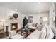 Bright living room with a cozy fireplace, plush seating, and elegant decor creates a warm and inviting atmosphere at 879 Wildwood Ne Rd, Atlanta, GA 30324