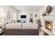 Comfortable living room with fireplace, hardwood floors, and stylish decor offers an inviting space for relaxation at 879 Wildwood Ne Rd, Atlanta, GA 30324