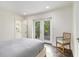 Bedroom featuring access to outdoor deck and adjoining bathroom at 879 Wildwood Ne Rd, Atlanta, GA 30324