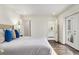 Bedroom features door to outdoor deck, adjoining bathroom and recessed lighting at 879 Wildwood Ne Rd, Atlanta, GA 30324