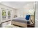 Bedroom features door to outdoor deck, recessed lighting and neutral palette at 879 Wildwood Ne Rd, Atlanta, GA 30324