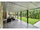 Backyard featuring a covered porch area, staircase, and lush greenery at 879 Wildwood Ne Rd, Atlanta, GA 30324