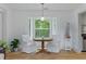 Bright dining area with a bay window, hardwood floors, and comfortable seating at 121 Gosdin Rd, Palmetto, GA 30268