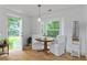 Bright dining area with hardwood floors, natural light and table with seating for two at 121 Gosdin Rd, Palmetto, GA 30268