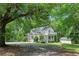 Exterior home nestled among lush trees and greenery in a natural setting at 121 Gosdin Rd, Palmetto, GA 30268