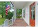 Inviting porch with a swing, charming decor, and a view of the greenery at 121 Gosdin Rd, Palmetto, GA 30268