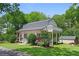 Exterior of home with a front porch, second story balcony, large front yard, and detached shed at 121 Gosdin Rd, Palmetto, GA 30268