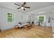 Bright and open living space with hardwood floors, and a view of the dining area at 121 Gosdin Rd, Palmetto, GA 30268