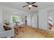 Inviting living room with hardwood floors, a ceiling fan, and a comfortable seating area at 121 Gosdin Rd, Palmetto, GA 30268