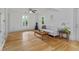 Spacious living room featuring gleaming hardwood floors and neutral paint at 121 Gosdin Rd, Palmetto, GA 30268