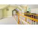 Finished attic space with wood railing, desk, and natural light at 1821 N Rock Springs Ne Rd, Atlanta, GA 30324