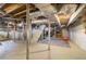 Unfinished basement featuring open ceiling, stairs to upper floor, and laundry machines at 1821 N Rock Springs Ne Rd, Atlanta, GA 30324