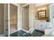 Elegant bathroom features a glass door shower, vanity, and tiled floor at 1821 N Rock Springs Ne Rd, Atlanta, GA 30324