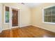 Bedroom with a wooden door that opens to a porch outside at 1821 N Rock Springs Ne Rd, Atlanta, GA 30324