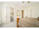 Bedroom with neutral walls and carpet, with a bed and view through to the bathroom at 1821 N Rock Springs Ne Rd, Atlanta, GA 30324