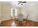 Bright dining area featuring hardwood floors, a round glass table, and seating for three at 1821 N Rock Springs Ne Rd, Atlanta, GA 30324