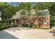 Brick house with large driveway, lush green trees and grass at 1821 N Rock Springs Ne Rd, Atlanta, GA 30324