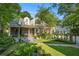 Beautiful home with a well-manicured lawn, brick exterior, and a welcoming front porch at 1821 N Rock Springs Ne Rd, Atlanta, GA 30324