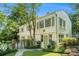 Beautiful home exterior with lush landscaping, a well-manicured lawn, and green accents at 1821 N Rock Springs Ne Rd, Atlanta, GA 30324